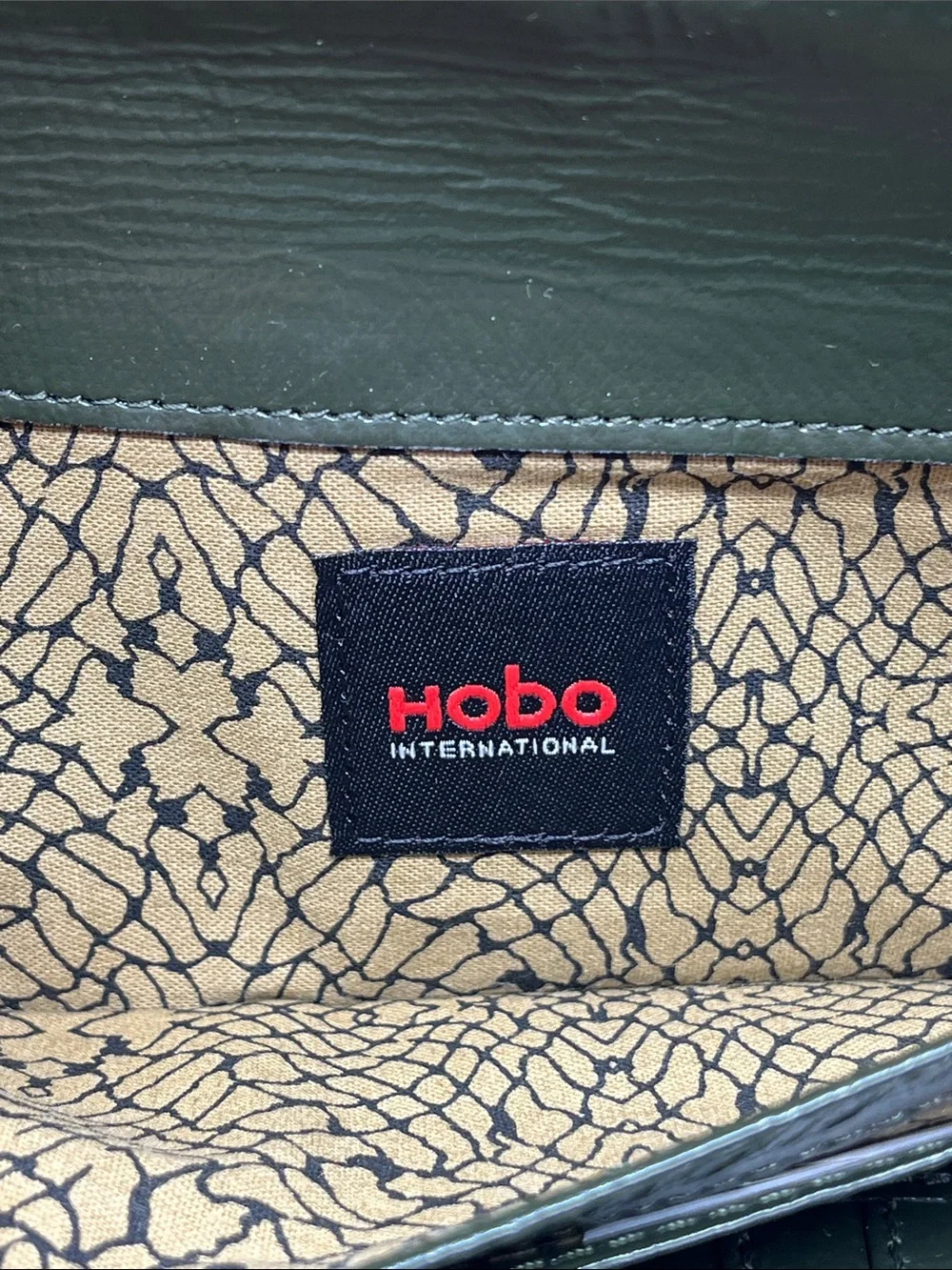 HOBO INTERNATIONAL CLUTCH WALLET ASYMMETRICAL ZIPPER PATENT LEATHER FOREST GREEN